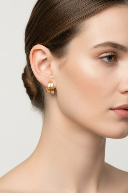Caucasian European model wearing Golden Wave Earrings - side angle